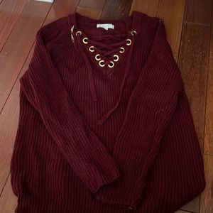 Oversized burgundy sweater with gold details